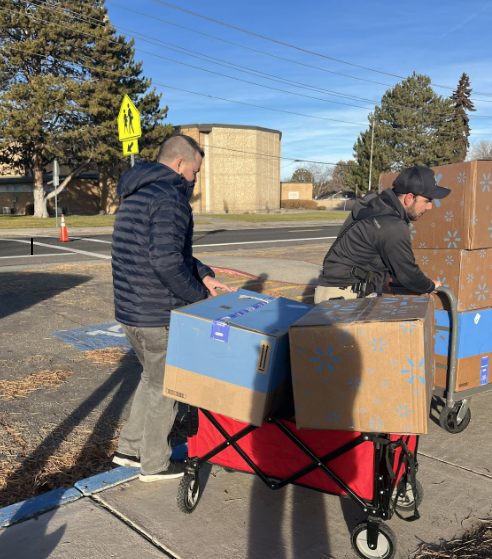Large boxes being loaded into a wagon