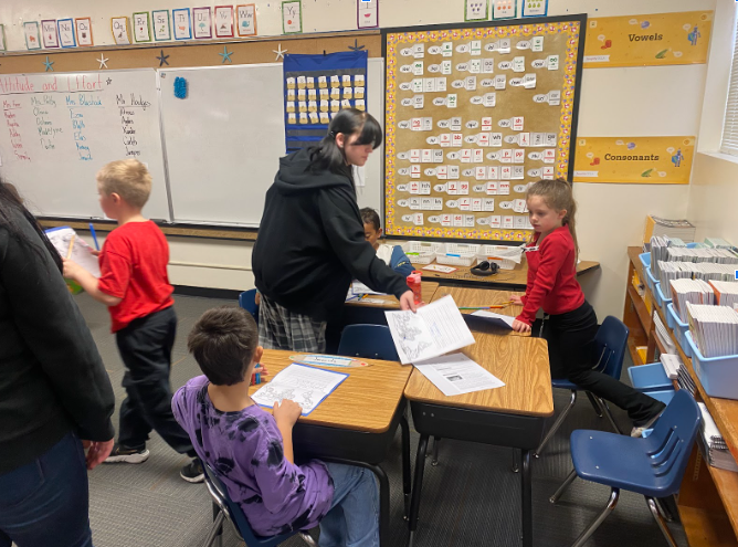 Assignments being passed out to students