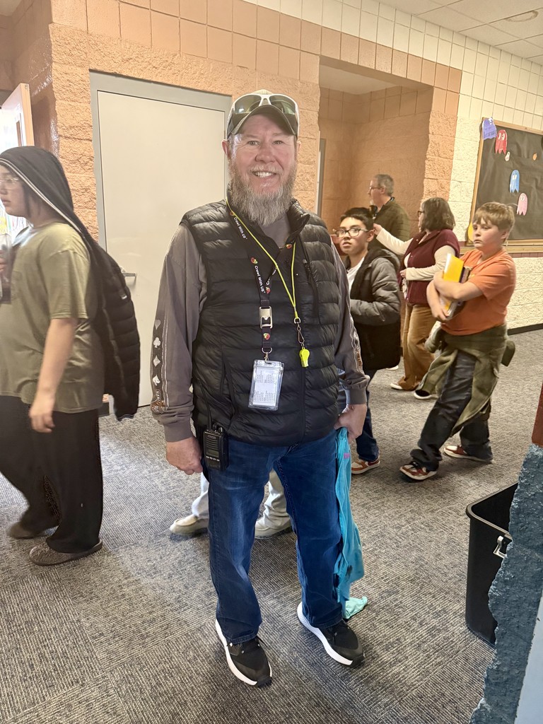 Support Staff Smiling in hallway