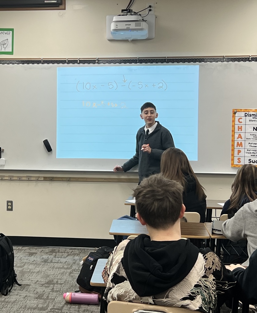 a male student leading the class in a math discussion