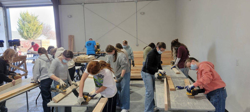 Students sanding 2x4's