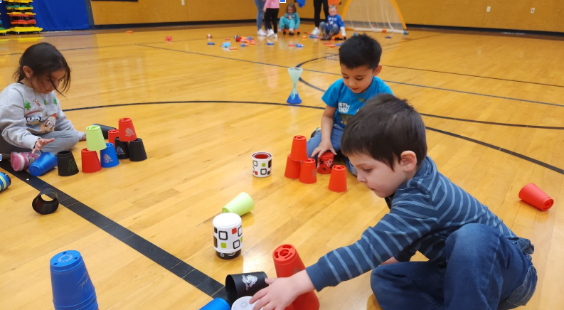 Students stacking cups