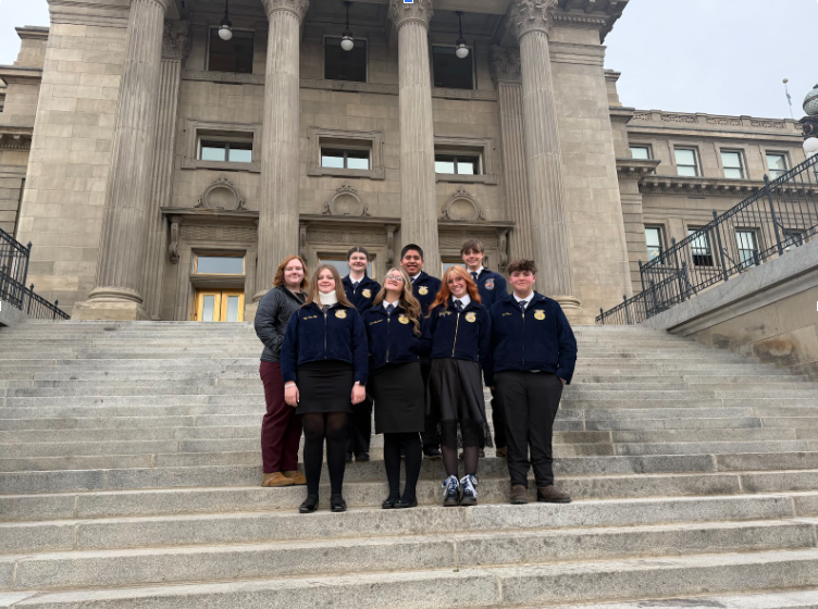 Group of students standing on steps of the capitol building