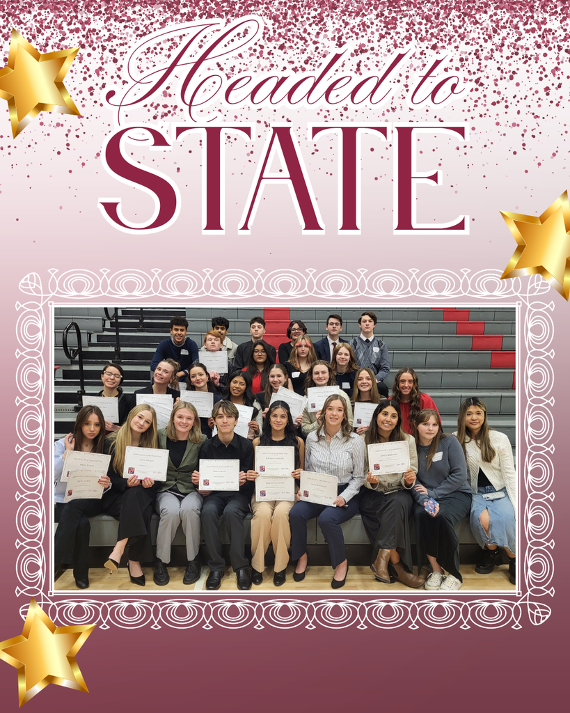 Students dressed professionally sitting on bleachers for picture