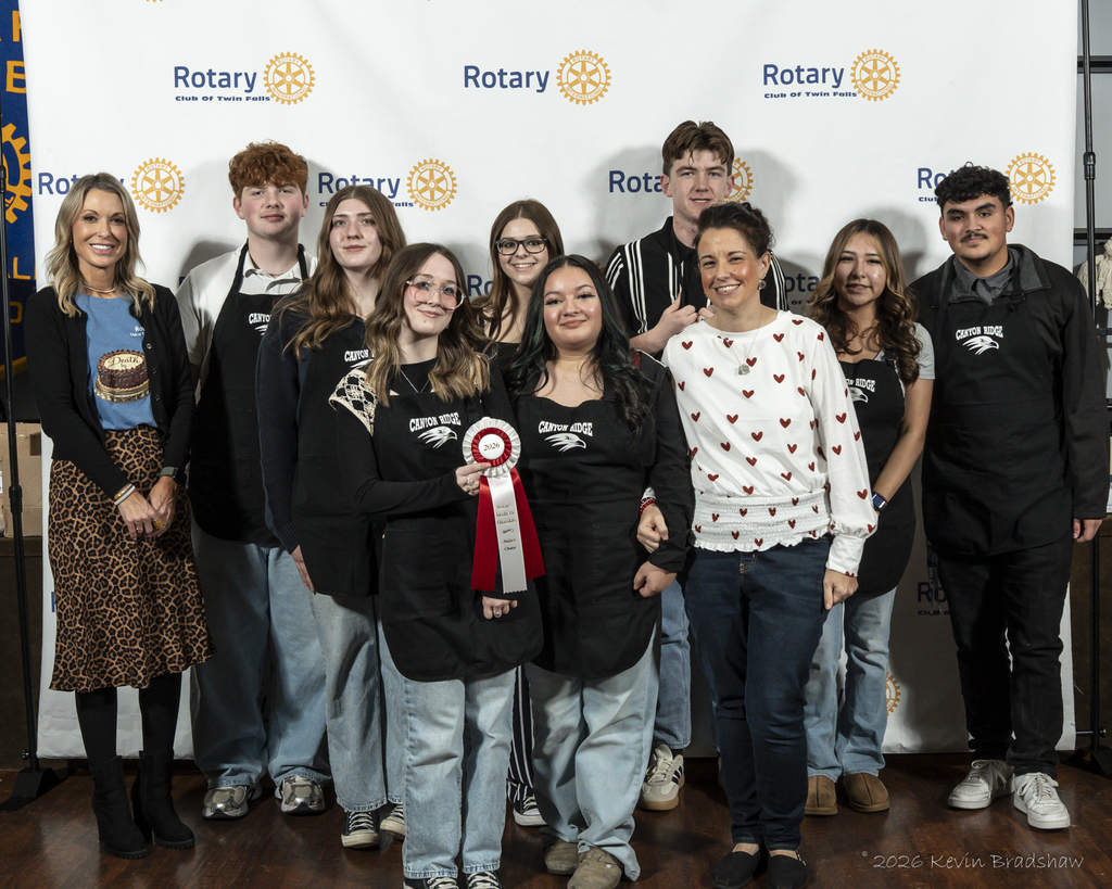 Students and advisor pictured with ribbon