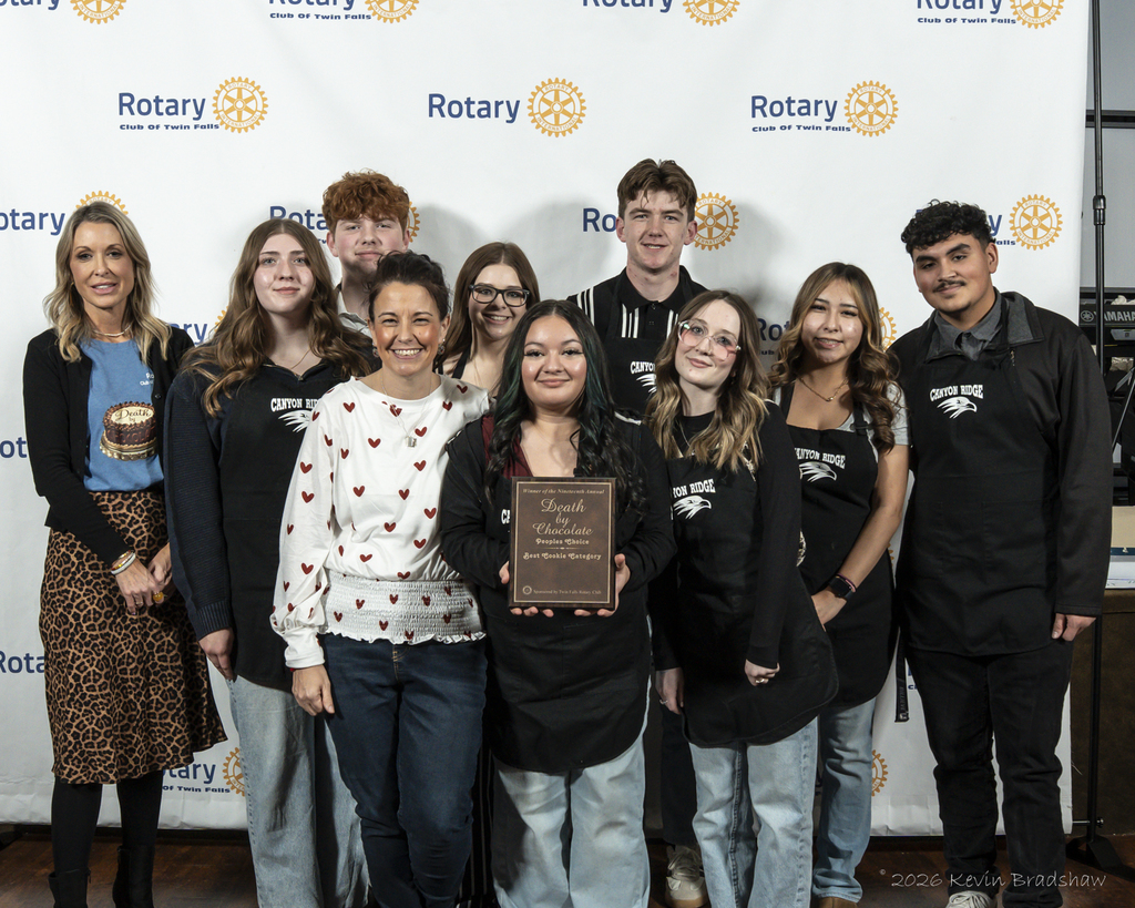 Students and advisor pictured with plaque