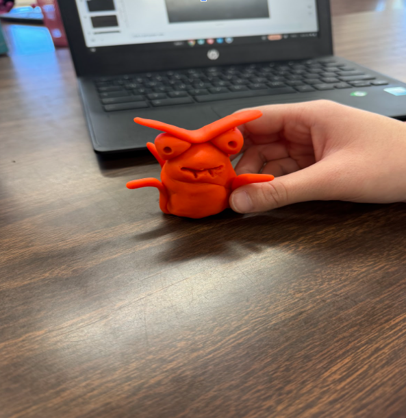 A student made playdoh figure with menacing eyebrows