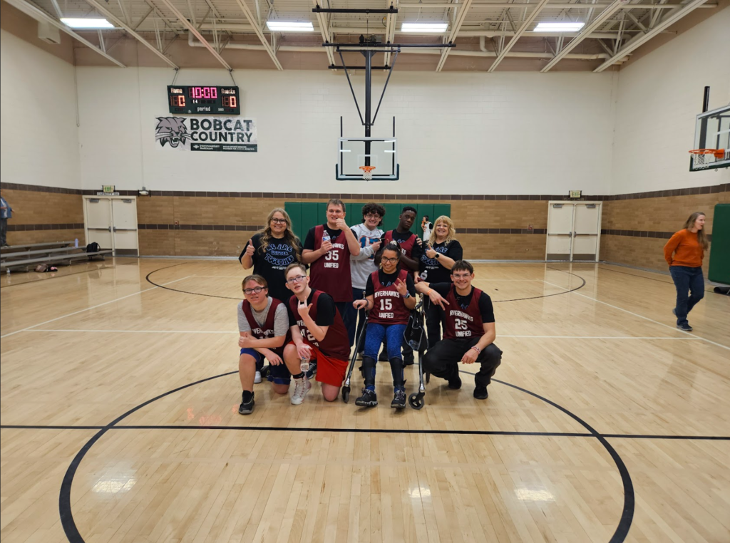 The team pictured together at center court