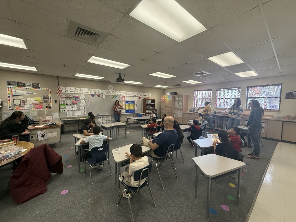 Students painting and smiling