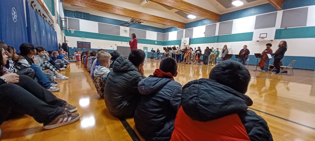 Students in gym patiently waiting
