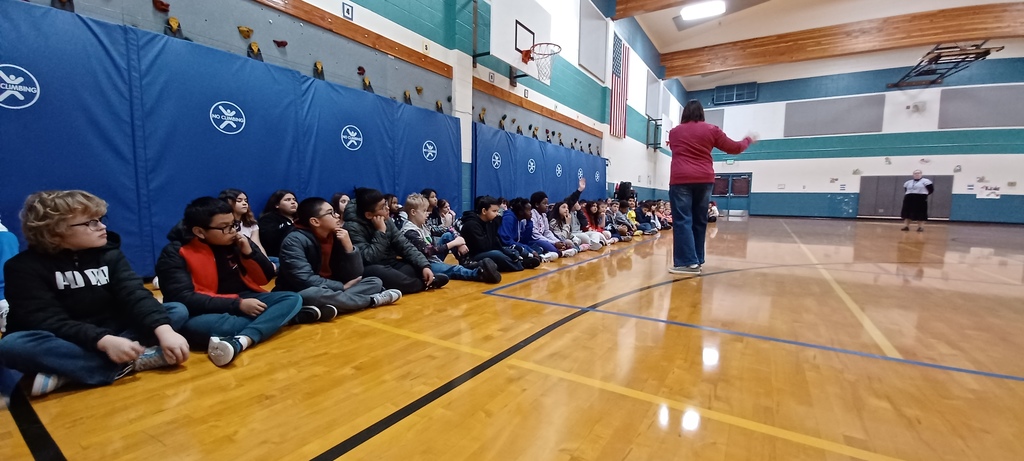 Students in gym patiently waiting