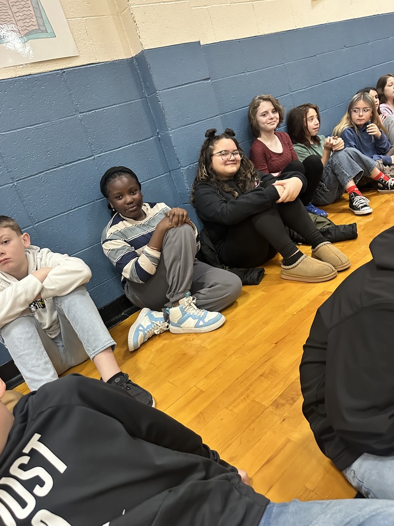 Students in gym patiently waiting