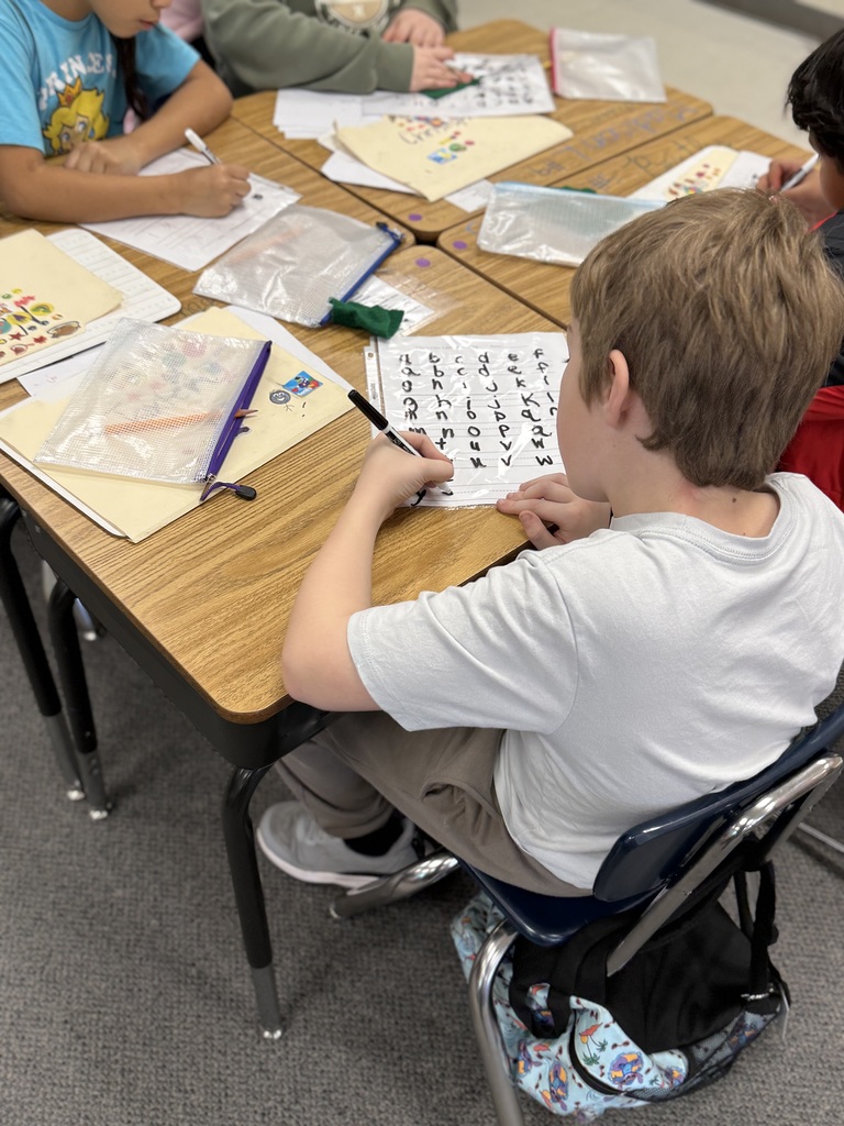 Student focusing on alphabet