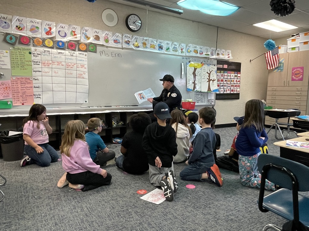 Officer Eric reading to our students