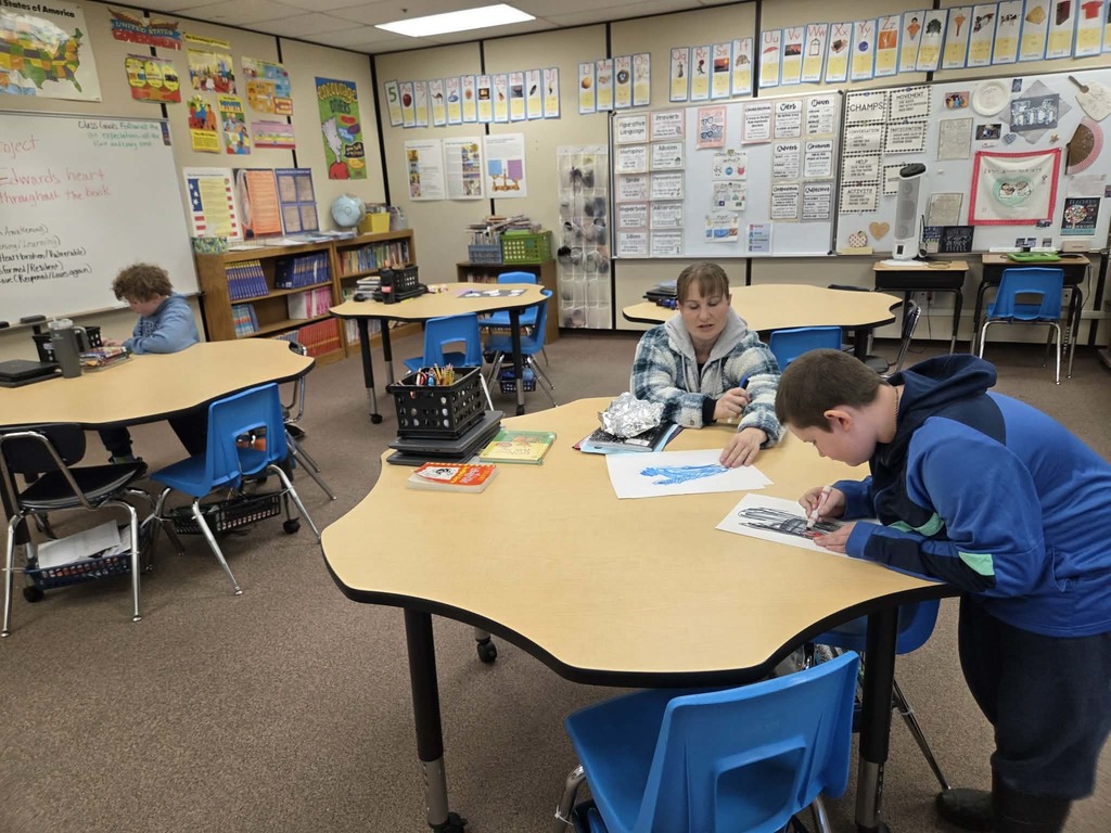 Families make hearts to reflect the stages of Edward's development.