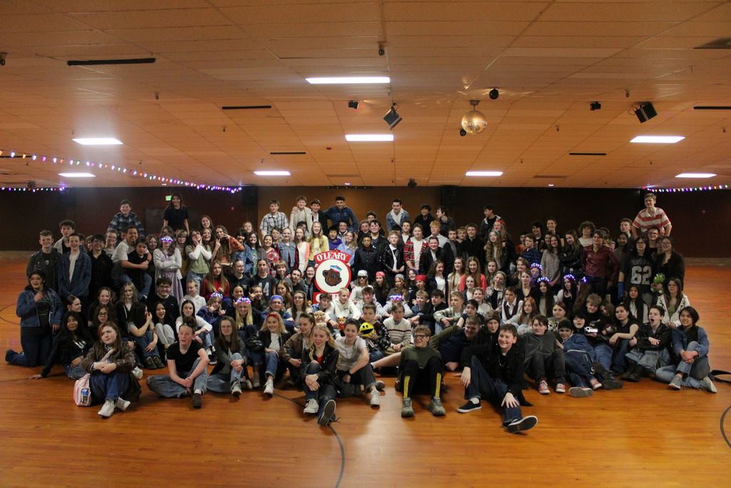 8th grade class at the roller rink