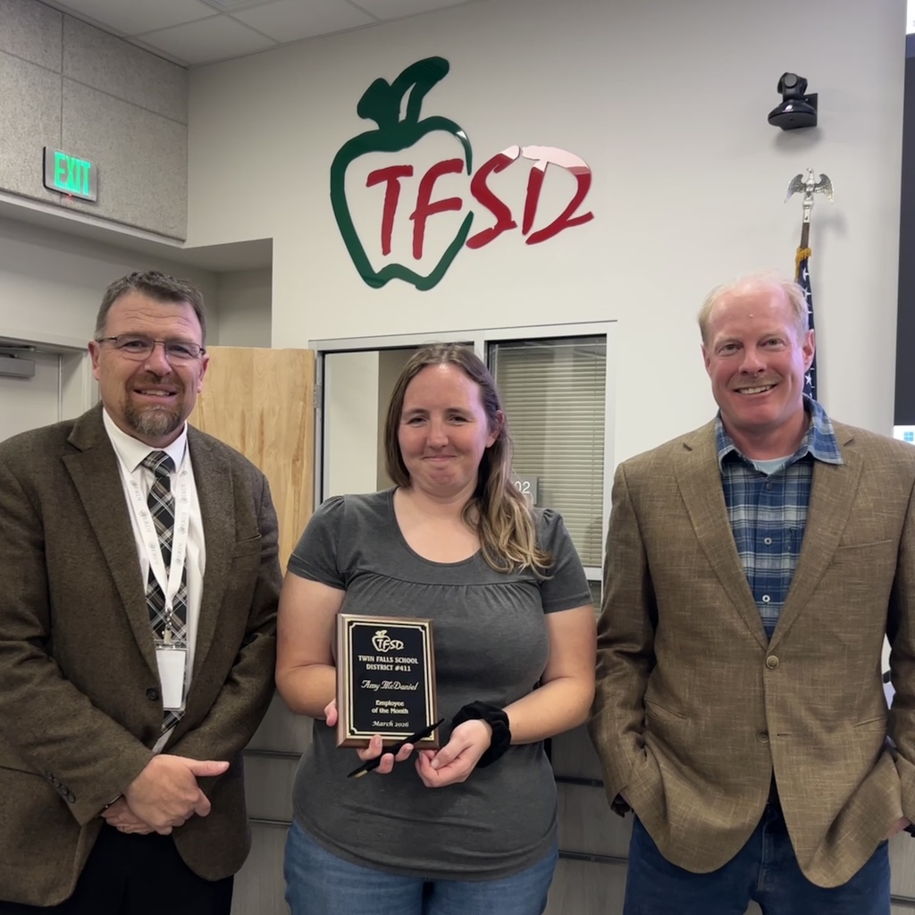 Employee of the Month pictured with superintendent and board member