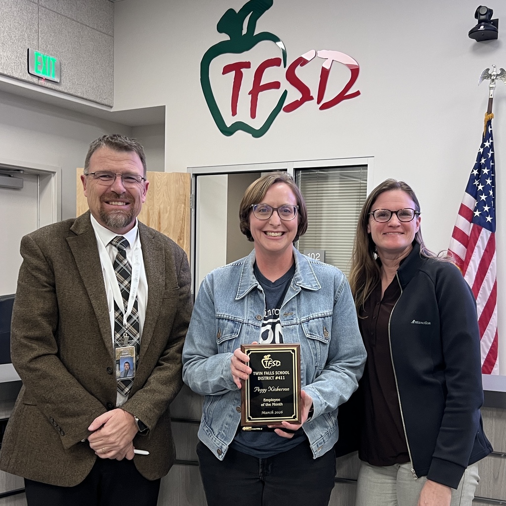 Employee of the Month pictured with superintendent and board member