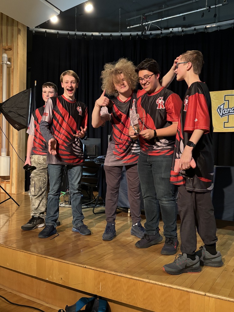 The team celebrating on stage