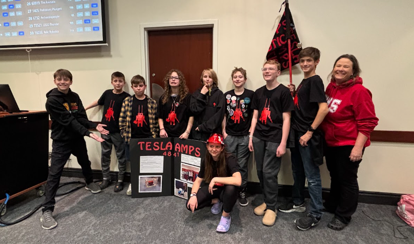 The team pictured standing together