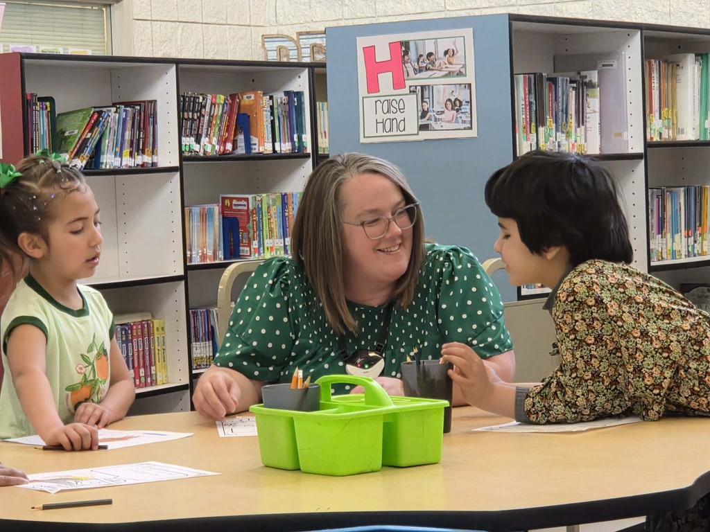 Mrs. Barrow working with students.