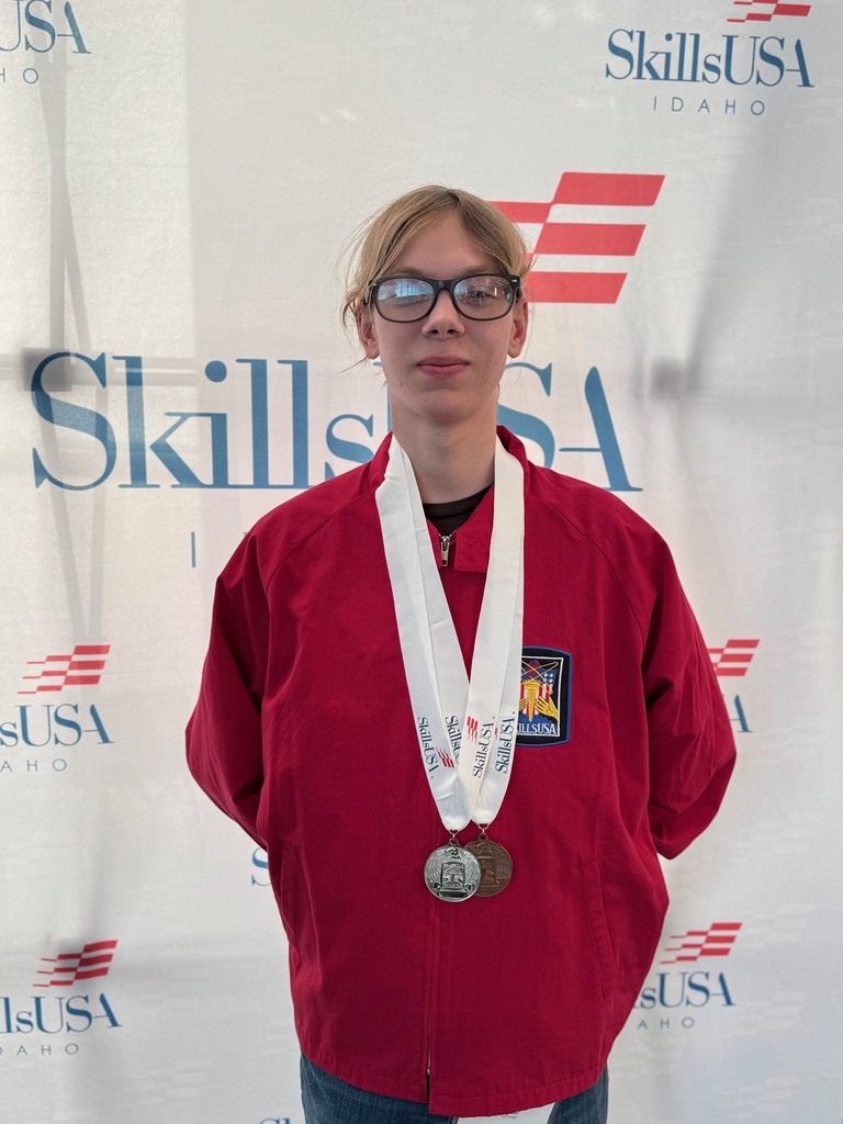 A students wearing two medals