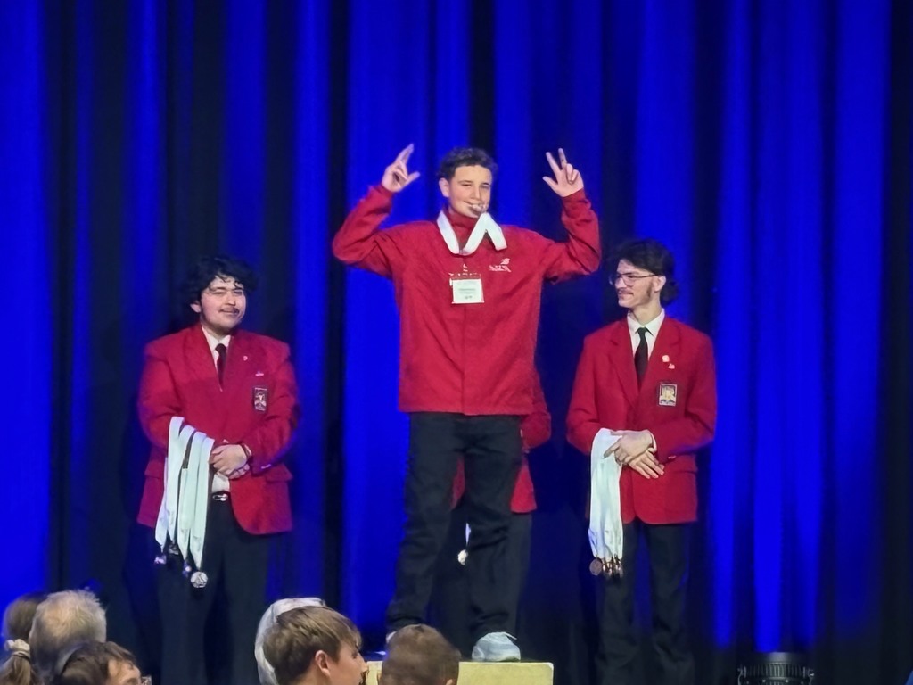Miguel on stage accepting his medal