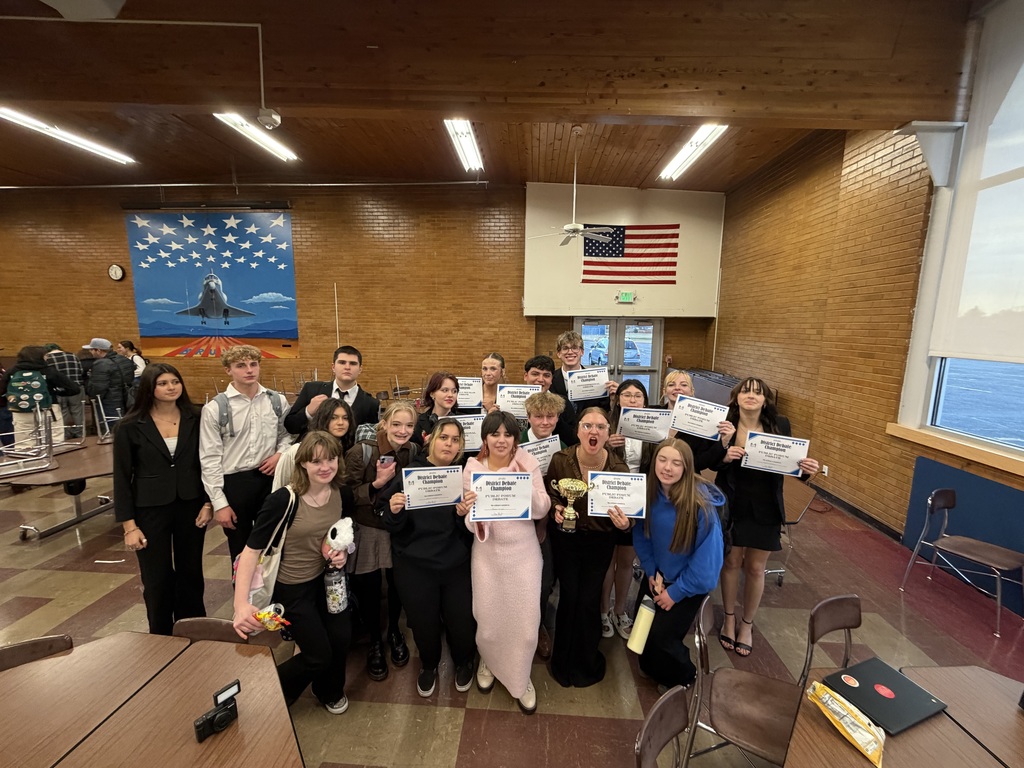 The group pictured together holding certificates