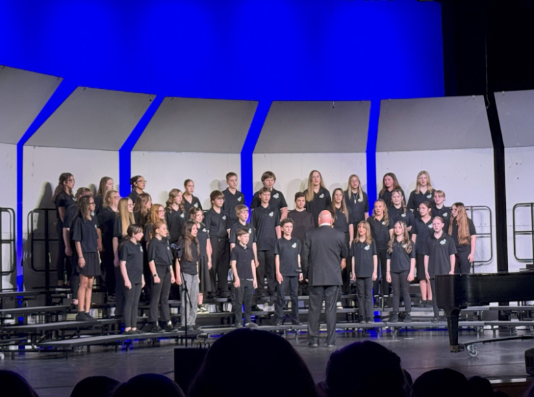 All of choir standing on choir risers