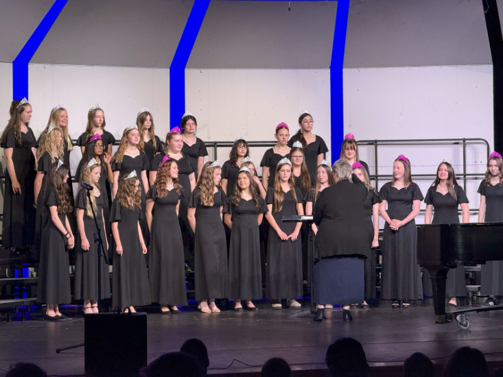 All of the girls standing on choir risers