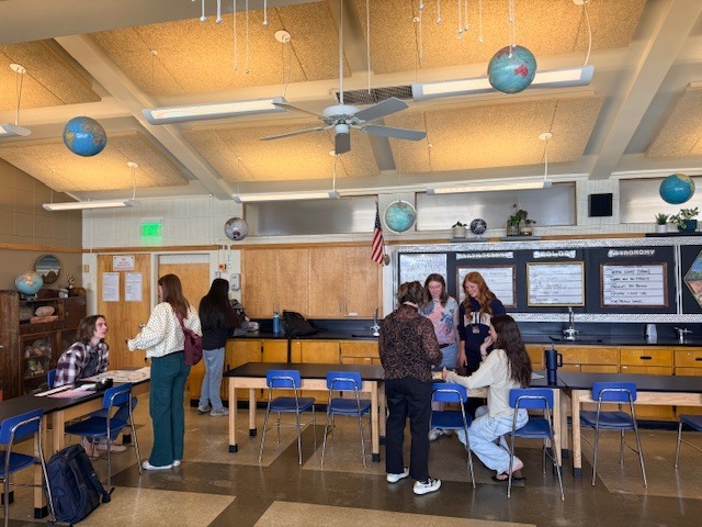 Students going station to station, playing their peer's games along the way