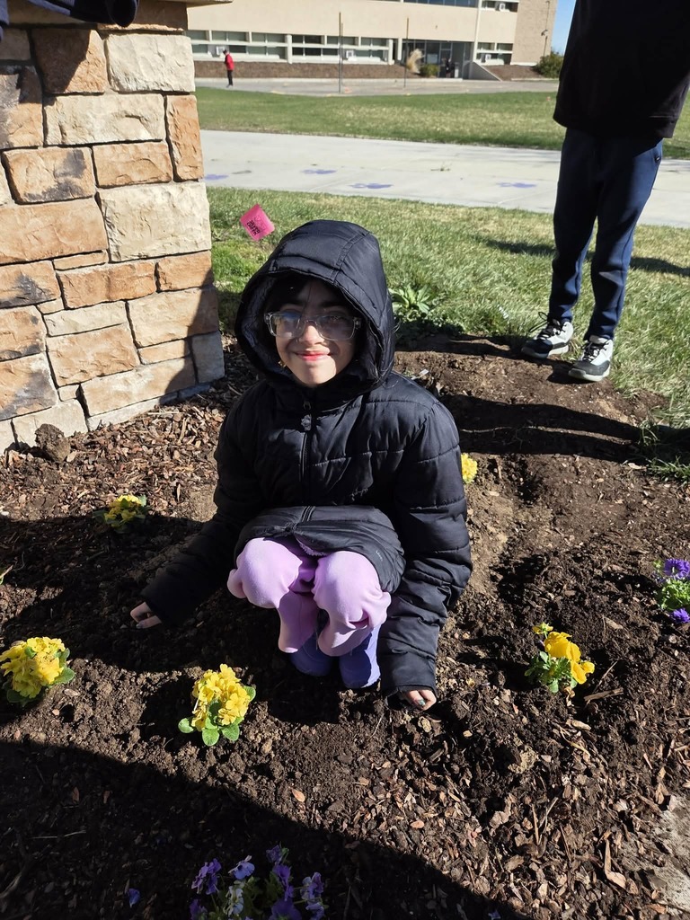 Student planting flowers