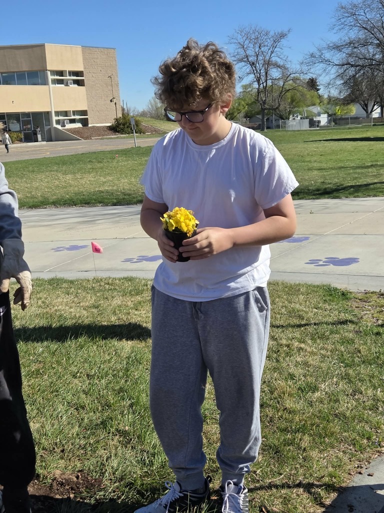 Student planting flowers