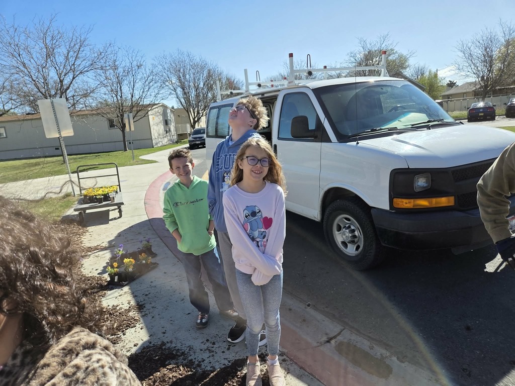 Students planting flowers