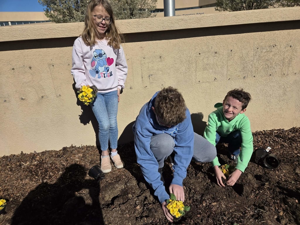 Students planting flowers