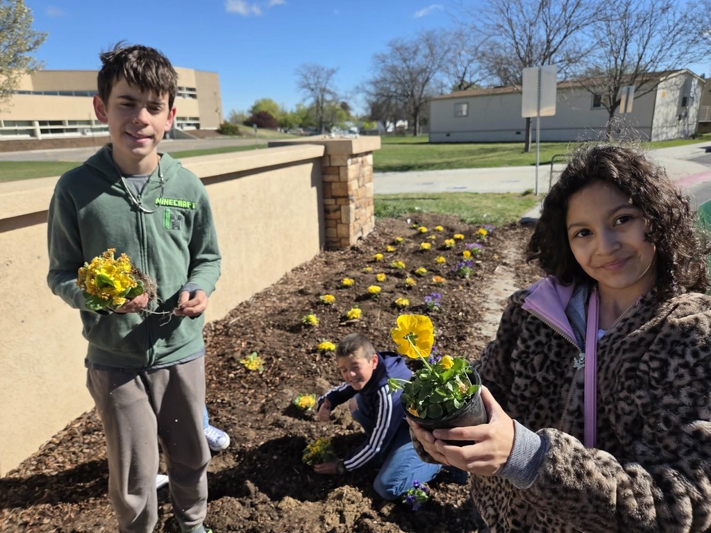 Students planting flowers