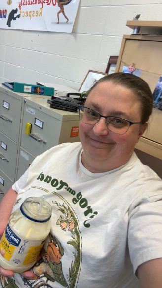 Teacher holding a open Best Foods brand mayonnaise jar filled with "mayonnaise"