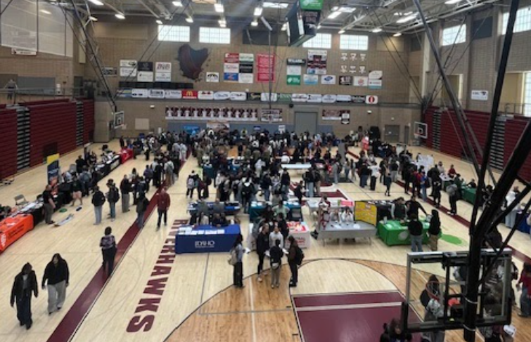 The gym at Canyon Ridge set up for a career fair and filled with students