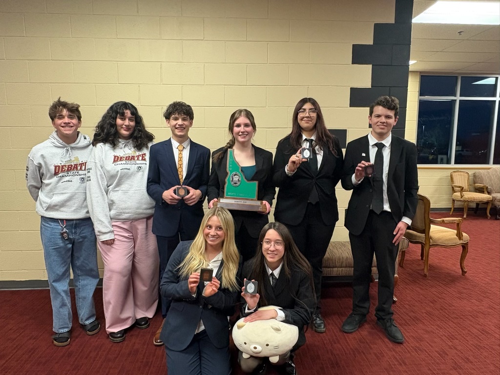 The group presenting their awards for the camera