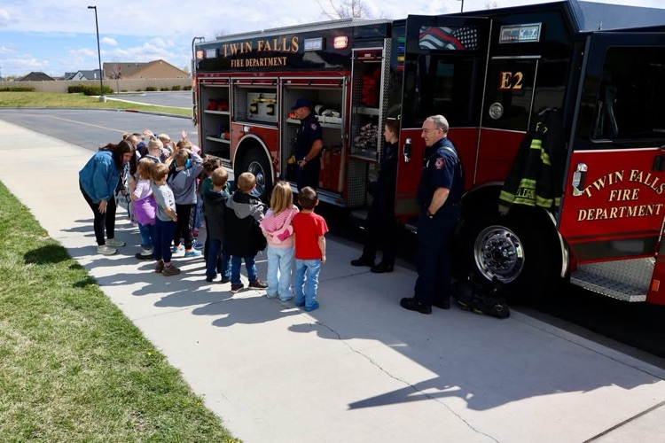 students looking at a fire truck