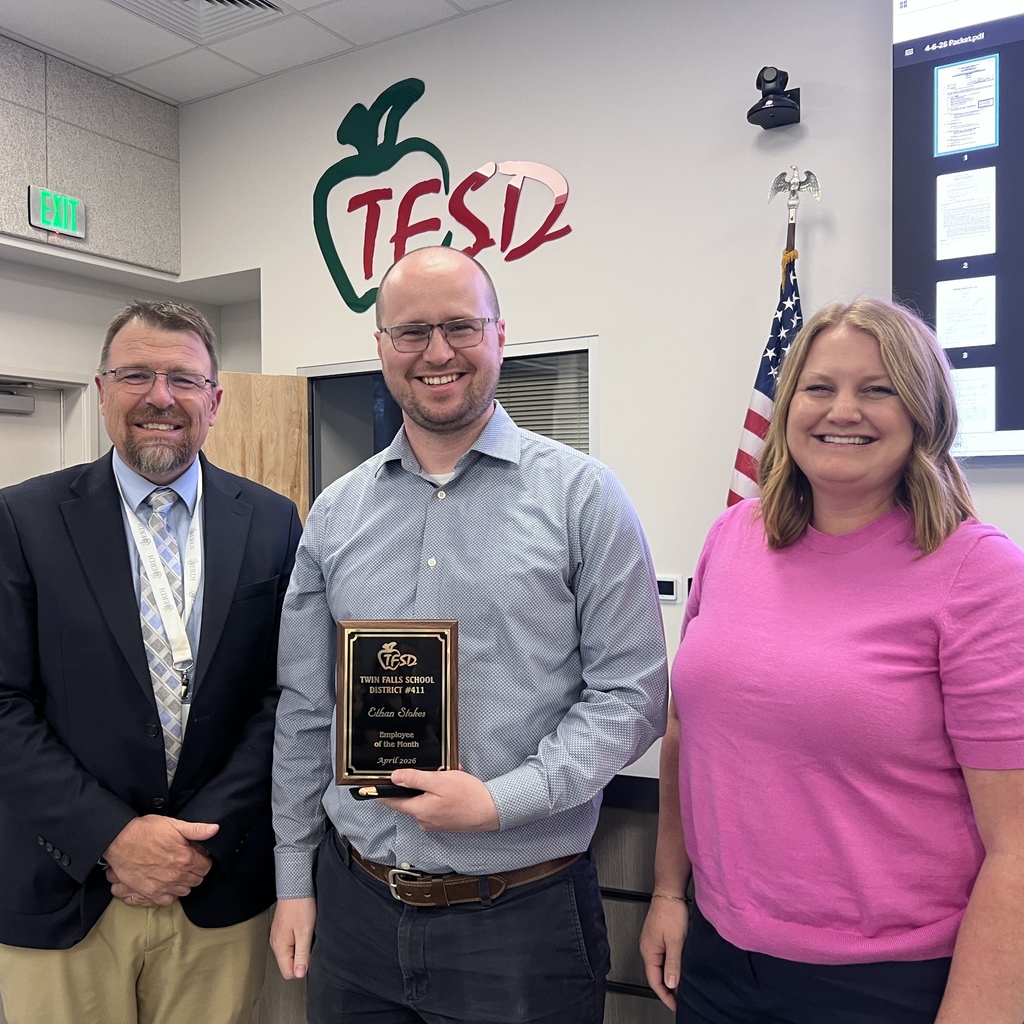 Employee of the Month pictured with superintendent and board member
