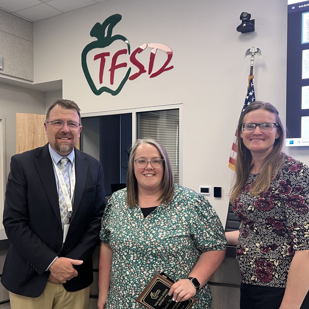 Employee of the Month pictured with superintendent and board member
