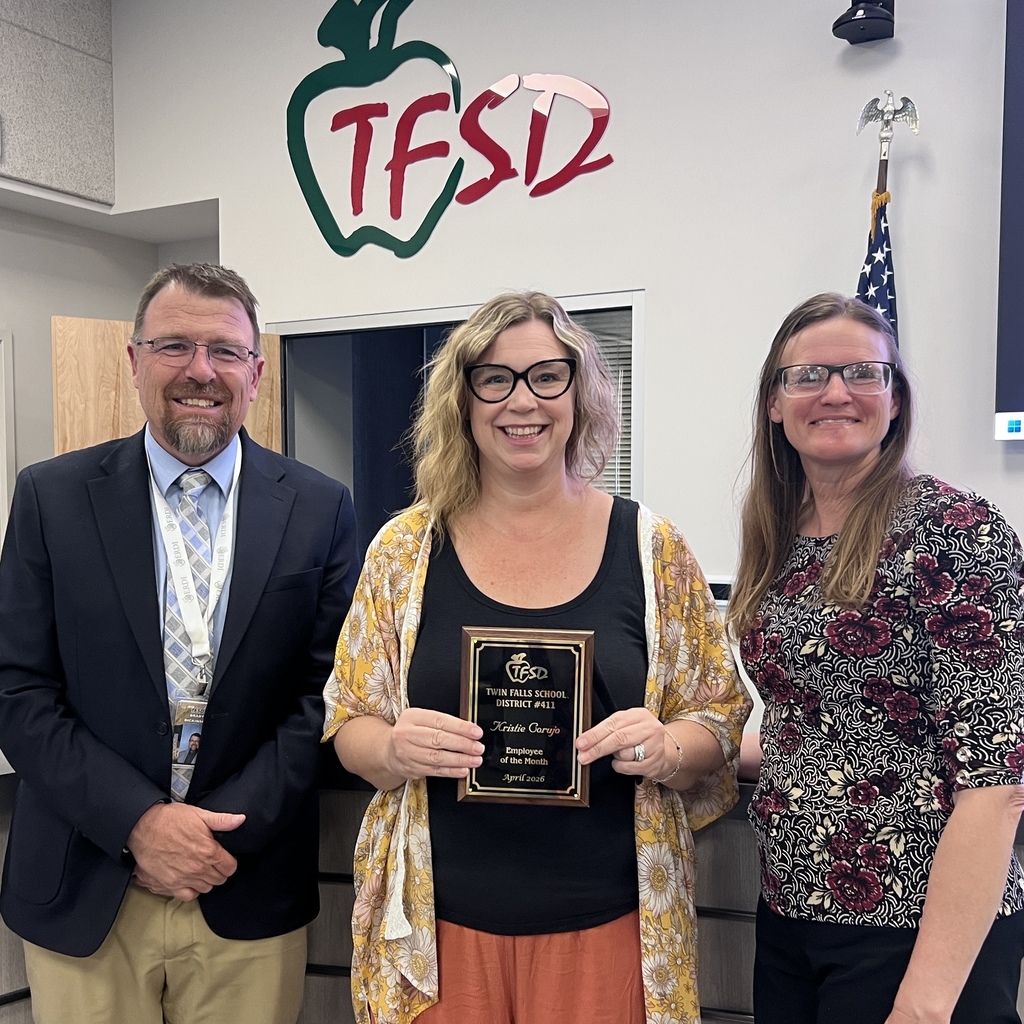 Employee of the Month pictured with superintendent and board member