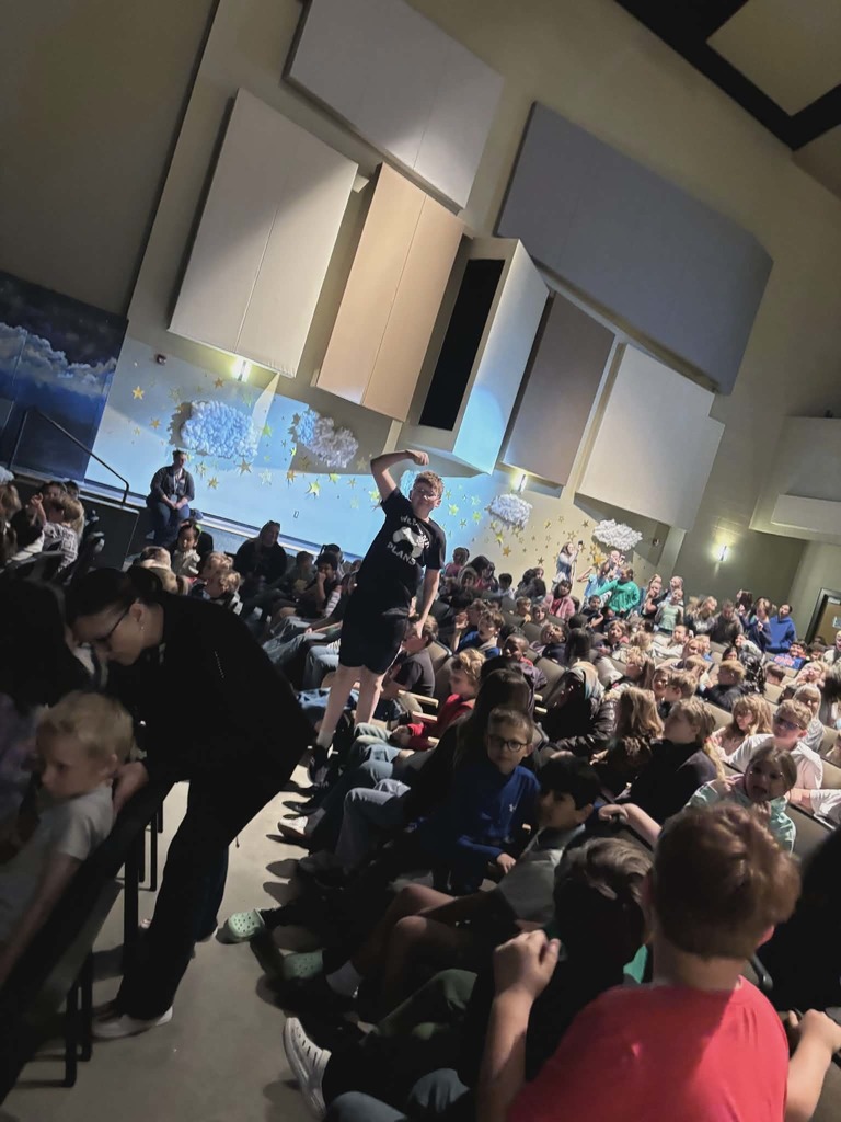 Students cheering at the Synergy performance