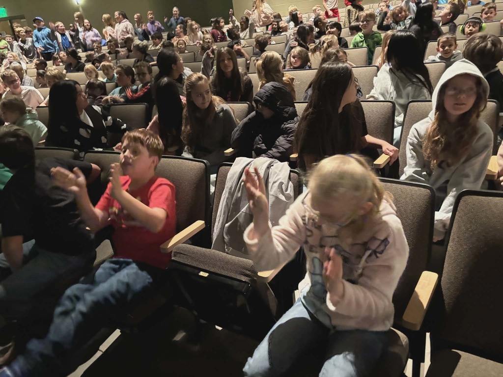 Students cheering at the Synergy performance