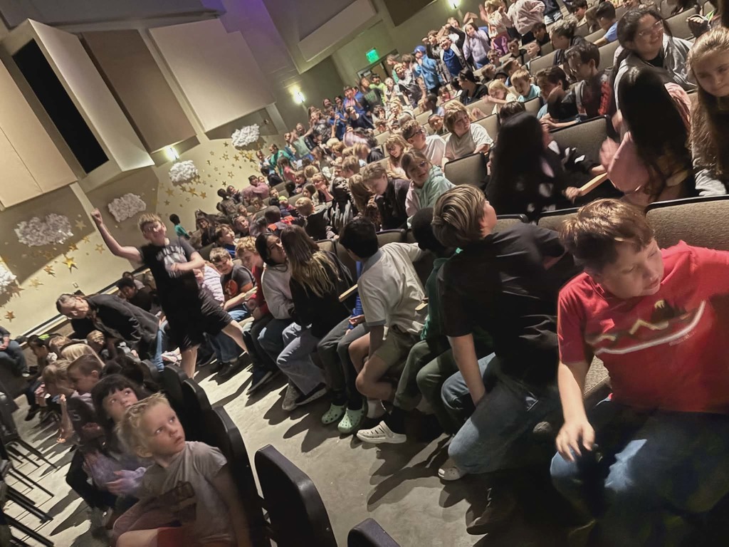 Students cheering at the Synergy performance