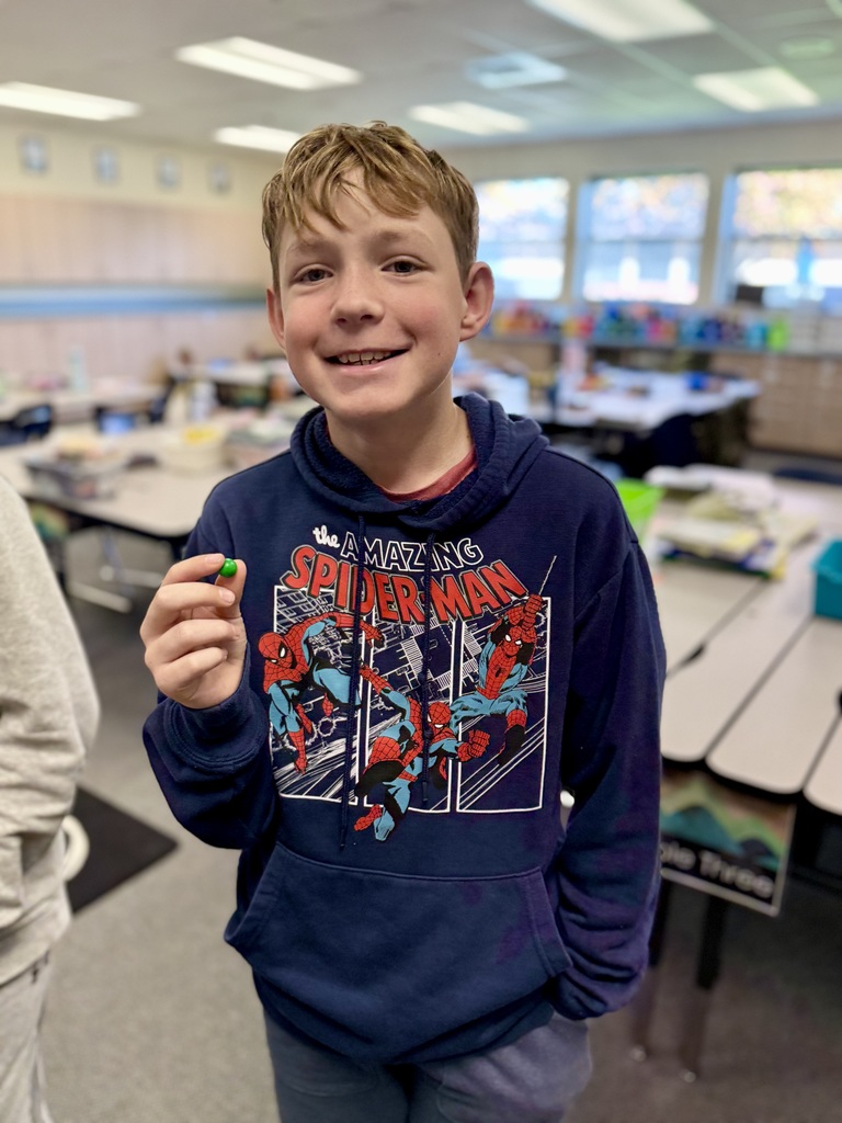 Student smiling without his braces