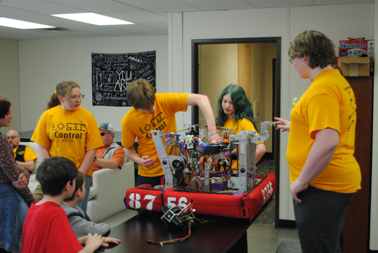 Students pictured participating in a science activity