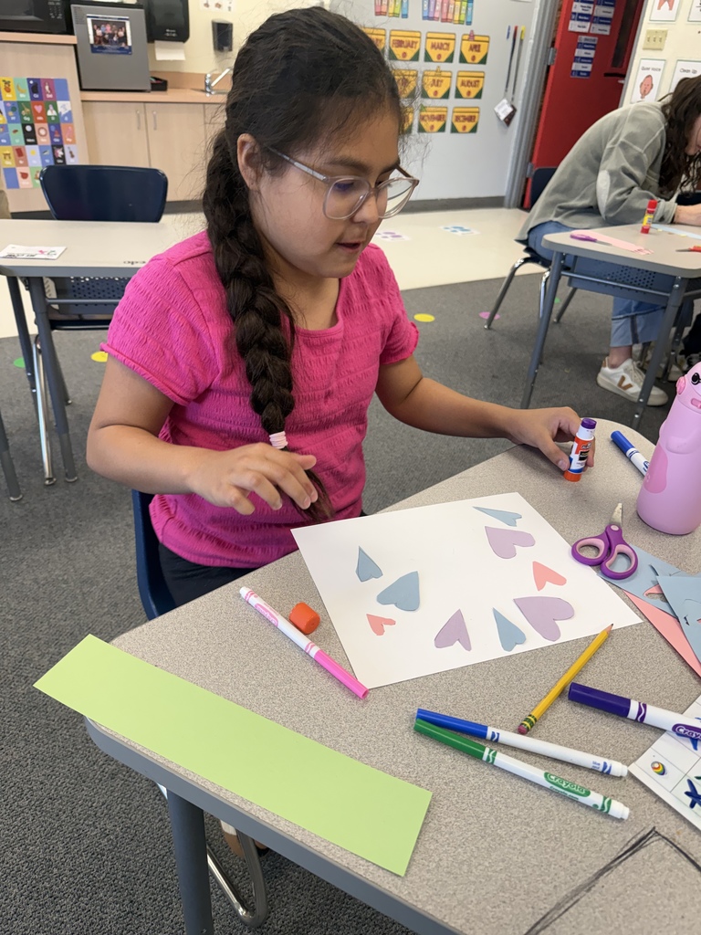 Students smiling during art