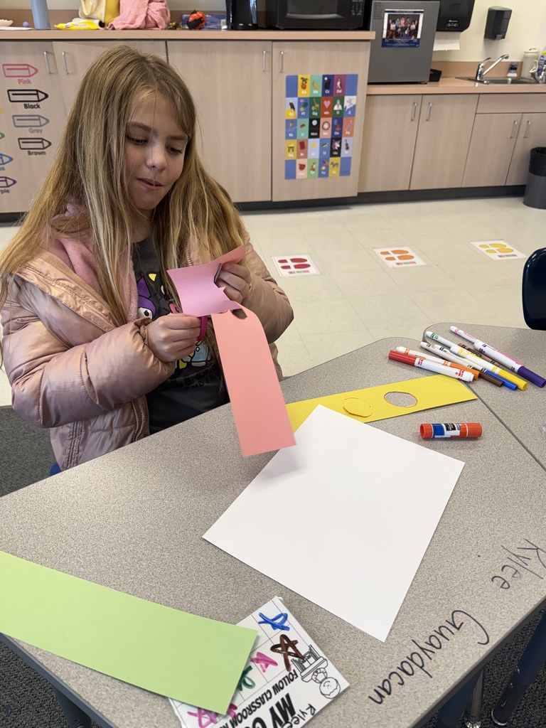 Students smiling during art